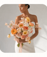 Bridal bouquet of coral ranunculus and garden roses