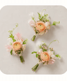 Boutonnieres laid out on linen